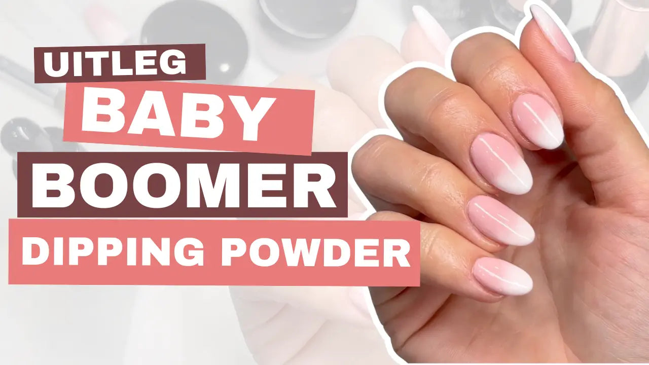 Hand met lange elegante nagels in zachte roze-witte ombre baby boomer dip powder afwerking