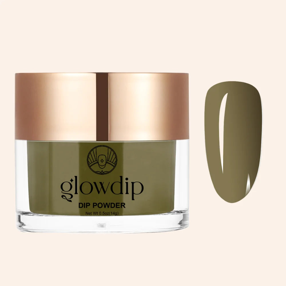 Olive green forest muse dipping powder in a clear glass jar with rose gold lid shown next to finished nail look